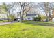 Ranch home with large front yard, mature trees, and detached garage at 80 S Mickley Ave, Indianapolis, IN 46241