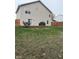 Large backyard with a deck, grill, and plenty of grass space at 10048 New Dawn Pl, Avon, IN 46123