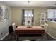 Charming dining room with a plaid tablecloth and a farmhouse-style table at 10048 New Dawn Pl, Avon, IN 46123