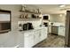 Modern kitchen with white cabinets, marble countertops, and stainless steel appliances at 10048 New Dawn Pl, Avon, IN 46123