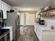 Modern kitchen with white cabinets, marble countertops, and stainless steel appliances at 10048 New Dawn Pl, Avon, IN 46123