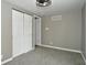 Spacious bedroom featuring neutral walls, carpet, and ample closet space at 11365 W State Road 142, Martinsville, IN 46151