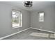 Bright bedroom with neutral walls, plush carpeting, and large windows at 11365 W State Road 142, Martinsville, IN 46151