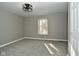 Well-lit bedroom with neutral walls, carpet flooring, and a window with natural light at 11365 W State Road 142, Martinsville, IN 46151