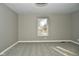Charming bedroom with neutral walls, carpet, and a view from the window at 11365 W State Road 142, Martinsville, IN 46151