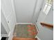 Inviting entryway with gray carpet, colorful mat, and wooden stairs at 11365 W State Road 142, Martinsville, IN 46151