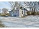 Gray house with teal accents and a small yard at 11365 W State Road 142, Martinsville, IN 46151