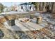 Cozy fire pit area with tree stump seating in the backyard at 11365 W State Road 142, Martinsville, IN 46151