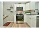 Modern kitchen featuring stainless steel appliances and white shaker cabinets at 11365 W State Road 142, Martinsville, IN 46151