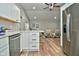 Open concept kitchen with island, stainless steel appliances, and hardwood floors at 11365 W State Road 142, Martinsville, IN 46151
