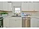 Kitchen with white cabinets, stainless steel appliances, and a farmhouse sink at 11365 W State Road 142, Martinsville, IN 46151