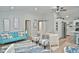 Open concept living room with a teal couch, dining area, and kitchen at 11365 W State Road 142, Martinsville, IN 46151