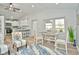 Open concept living room and kitchen with vaulted ceilings, hardwood floors, and modern decor at 11365 W State Road 142, Martinsville, IN 46151