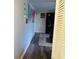 Bright hallway with laminate flooring and access to other rooms at 2928 Shakespeare Dr, Indianapolis, IN 46227