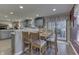 Bright dining area with wood table and chairs next to sliding glass doors at 3338 Shady Maple Way, Indianapolis, IN 46227