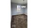 Simple dining room with carpet and a chandelier at 3801 Boundary Bay Dr, Indianapolis, IN 46217