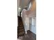Staircase and entryway with gray walls and hardwood floor at 3801 Boundary Bay Dr, Indianapolis, IN 46217