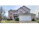 Charming two-story home with a two-car garage and landscaped front yard at 3801 Boundary Bay Dr, Indianapolis, IN 46217