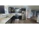 Updated kitchen with dark cabinets and stainless steel appliances at 3801 Boundary Bay Dr, Indianapolis, IN 46217