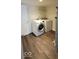 Basement laundry room features washer, dryer, and vinyl flooring at 3801 Boundary Bay Dr, Indianapolis, IN 46217