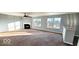 Bright living room featuring a fireplace and ample natural light at 3801 Boundary Bay Dr, Indianapolis, IN 46217