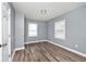 Spacious bedroom with gray walls and wood-look flooring at 4209 E 30Th St, Indianapolis, IN 46218