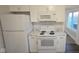 White kitchen appliances and marble countertops at 4745 W Legrande Ave, Indianapolis, IN 46241