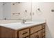 Clean bathroom with wood vanity and a large mirror at 5059 Countess Dr, Columbus, IN 47203