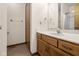 Clean bathroom with wood vanity, shower, and bathtub at 5059 Countess Dr, Columbus, IN 47203