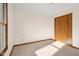 Spacious bedroom with double doors and a window at 5059 Countess Dr, Columbus, IN 47203