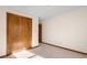 Simple bedroom with double doors and carpet flooring at 5059 Countess Dr, Columbus, IN 47203