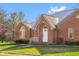 Brick facade with arched entryway and landscaping at 5059 Countess Dr, Columbus, IN 47203