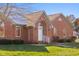 Brick house exterior with arched entryway and landscaping at 5059 Countess Dr, Columbus, IN 47203