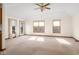 Bright living room with vaulted ceiling, carpet, and neutral walls at 5059 Countess Dr, Columbus, IN 47203
