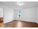 Spacious bedroom with hardwood floors and a window with a view at 6005 S Darlington Rd, Jamestown, IN 46147