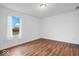 Bright bedroom featuring hardwood floors and a window with a view at 6005 S Darlington Rd, Jamestown, IN 46147