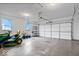 Spacious garage with overhead storage and room for a lawn tractor at 6005 S Darlington Rd, Jamestown, IN 46147