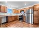 Modern kitchen with stainless steel appliances and light wood cabinets at 6005 S Darlington Rd, Jamestown, IN 46147