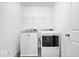 Bright laundry room with washer and dryer, and overhead shelving at 6005 S Darlington Rd, Jamestown, IN 46147