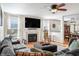 Living room with fireplace, sectional sofa and hardwood floors at 10135 Bootham Close, Fishers, IN 46038