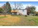 House's back with deck, shed, and grassy yard at 1124 Commission Rd, Greenwood, IN 46142