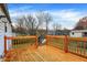 Wooden deck overlooking backyard with trees at 1124 Commission Rd, Greenwood, IN 46142