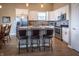 Modern kitchen with white cabinets, granite counters, and stainless steel appliances at 11809 Adair Pl, Indianapolis, IN 46229