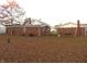 Brick house with large backyard covered in autumn leaves at 137 E Vine St, Jamestown, IN 46147