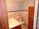 Clean bathroom with toilet, sink, and shower stall at 137 E Vine St, Jamestown, IN 46147