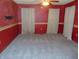 Simple bedroom with carpet and red walls at 137 E Vine St, Jamestown, IN 46147