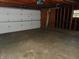 Spacious garage with overhead door and concrete floor at 137 E Vine St, Jamestown, IN 46147
