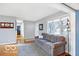 Living area with gray couch and hardwood floors at 2121 E 70Th St, Indianapolis, IN 46220