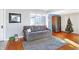 Living room with gray couch and hardwood floors at 2121 E 70Th St, Indianapolis, IN 46220