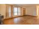 Living room featuring hardwood floors and a wood-burning stove at 217 N State Road 75, Danville, IN 46122